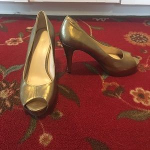 Metallic gold Nine West platform peep toe heels